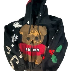 SKIMS Black Graphic Hoodie with Brown and Red Accents
